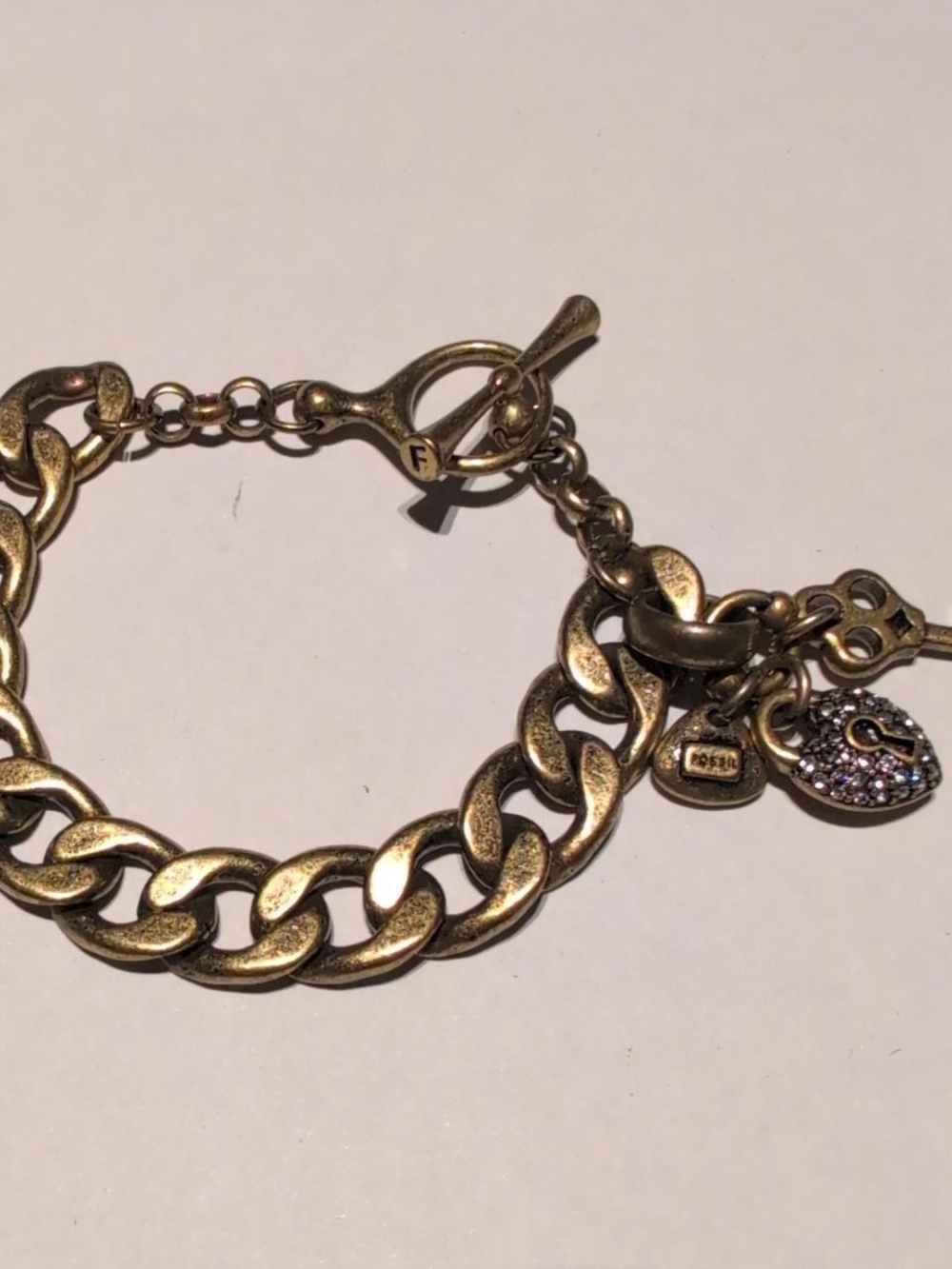Fossil distressed gold bracelet with heart and key charms #bling #jewelry